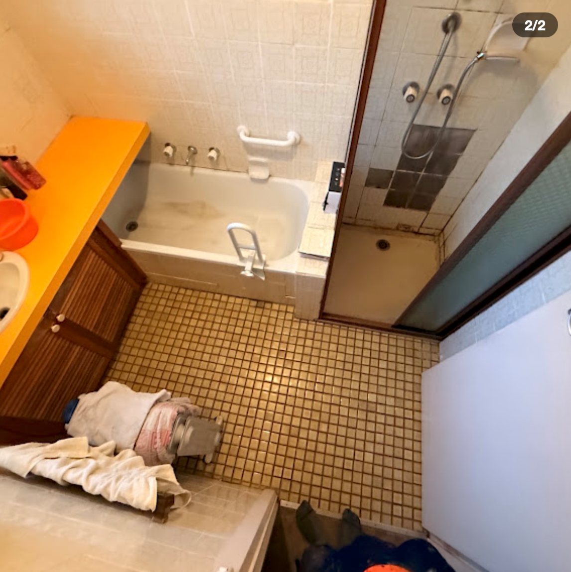 Bathroom before renovation in Glen Waverley — original 1980s tiles, orange vanity and dated fixtures